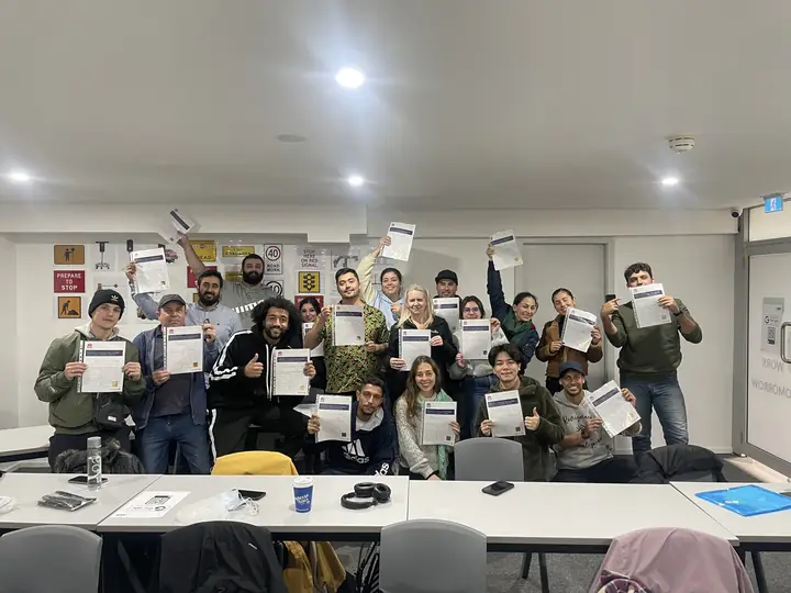 White Card class holding their certificates